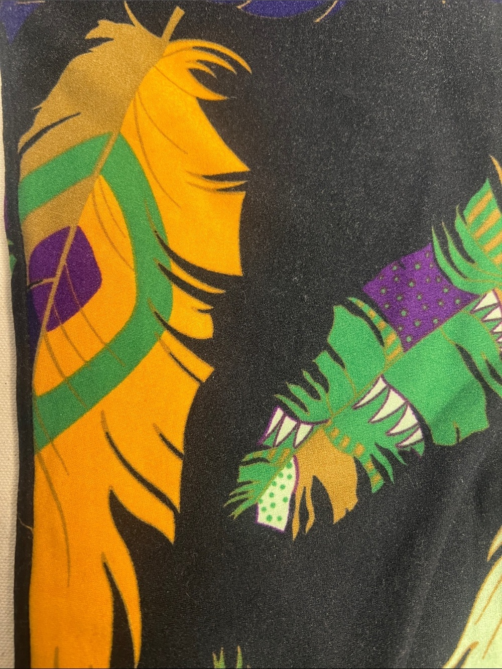 LuLaRoe Black Feather Print Leggings with Green, Purple & Gold Accents - Picture 3 of 5